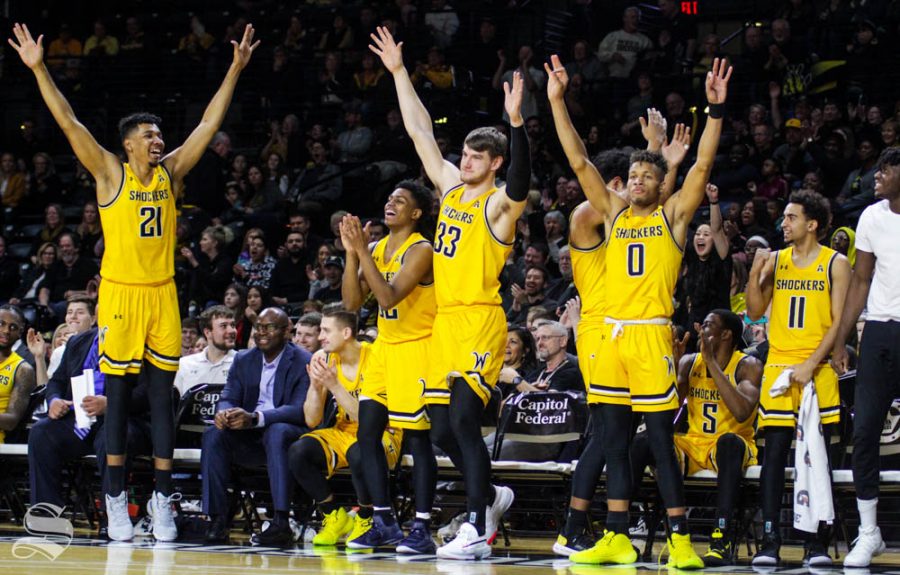 The Wichita State bench celebrates after walk-on sophomore Tate Busse makes a free-throw late in the second half of the game against Tulane on Feb. 16 inside Charles Koch Arena.