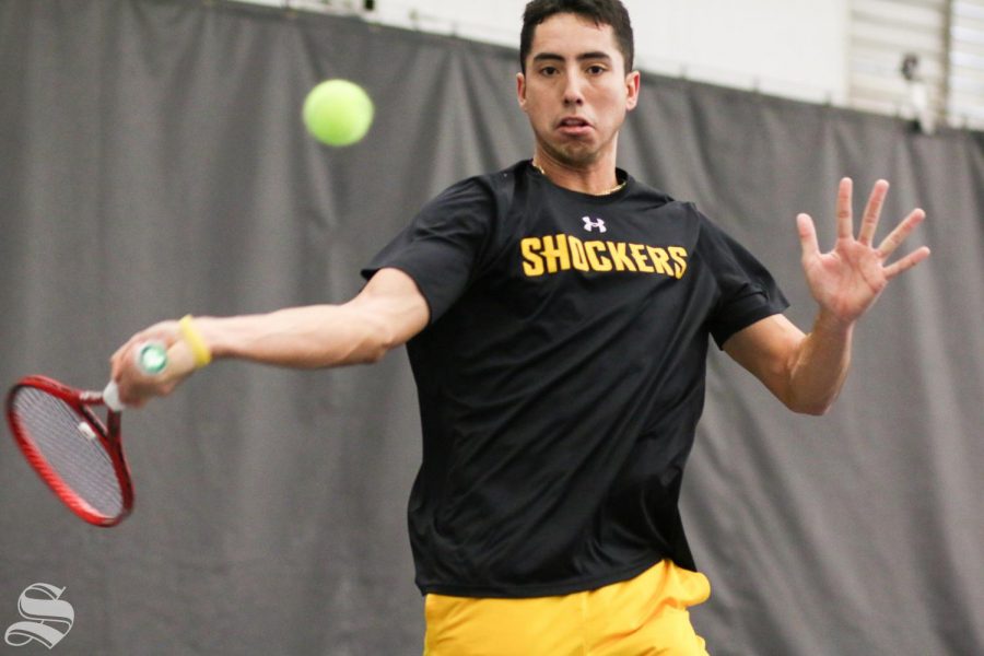 Wichita State senior Murkel Dellien volleys the ball back to UTA during the match held at Genesis Health Club on Friday, Feb. 21, 2020.