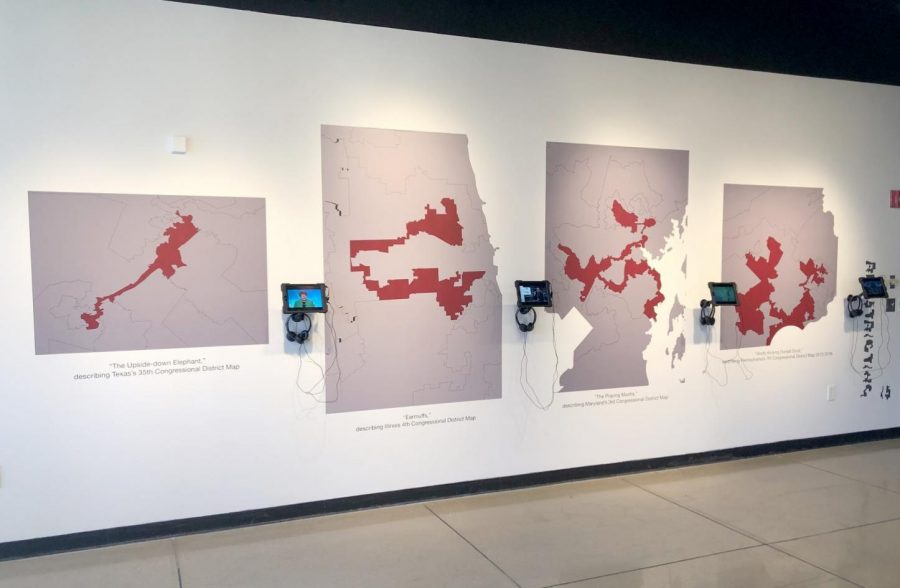 Brian Amos’ exhibit, “Representation: Slaying the Gerrymander”, is on display on the first floor of the Ulrich Museum of Art.