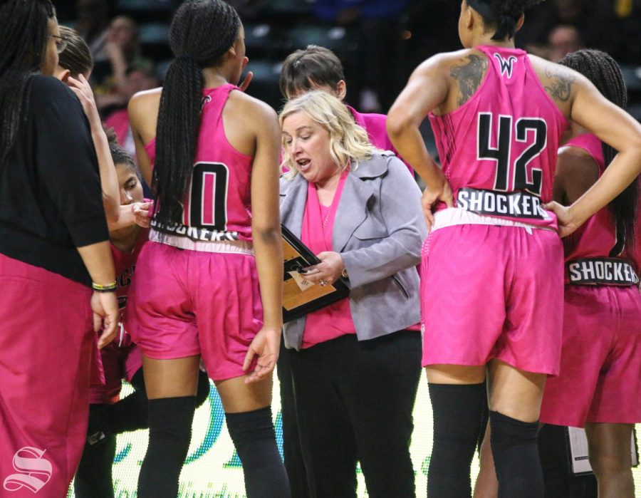 Wichita State head coach Keitha Adams speaks to players during a timeout in the last quarter of the game against East Carolina at Charles Koch Arena on Saturday, Feb. 1, 2020.
