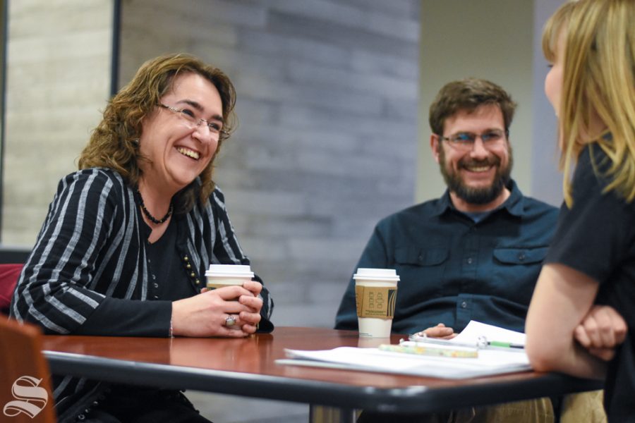 Lisa and Will Parcel, professors at Wichita State University, laugh while they answer questions from The Sunflower on Tuesday inside the Rhatigan Student Center.