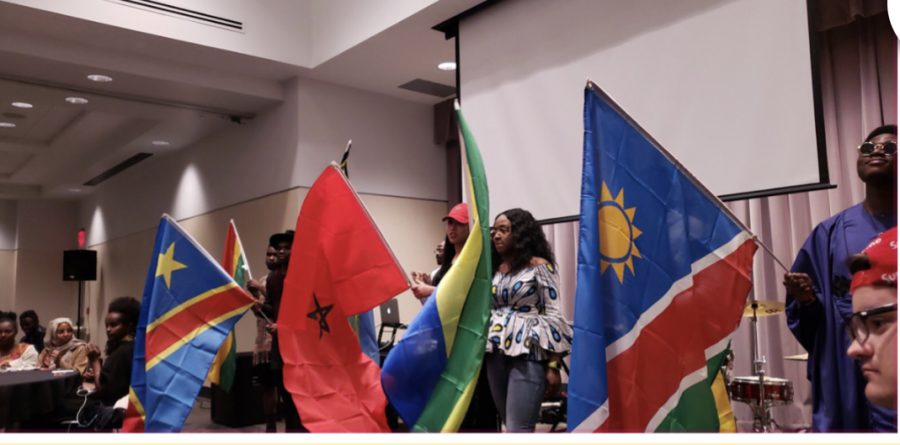 Students participate in a parade of flags at the Taste of Africa event, sponsored by the African Student Association, in November. Confirmed COVID-19 cases hit 1,000 on the continent over the weekend. Only 11 African nations have zero cases of COVID-19 as of Sunday afternoon.