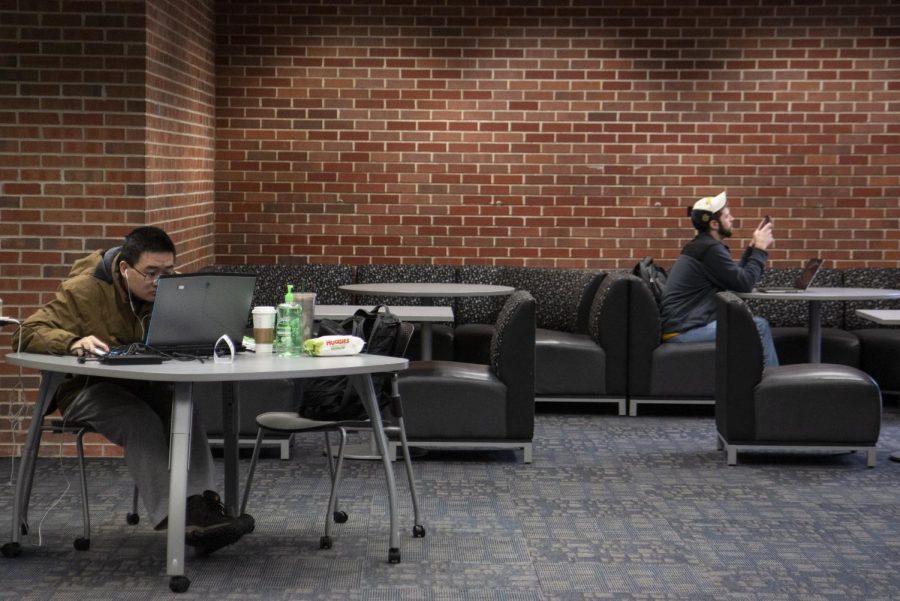 Students study in the Ablah Library on March 23. The library is set to reopen Tuesday. 