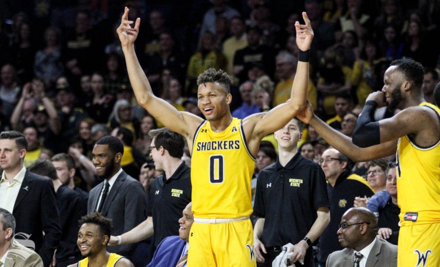 Wichita State sophomore Dexter Dennis celebrates on the bench during the second half of the game against Tulsa on March 8 inside Charles Koch Arena.