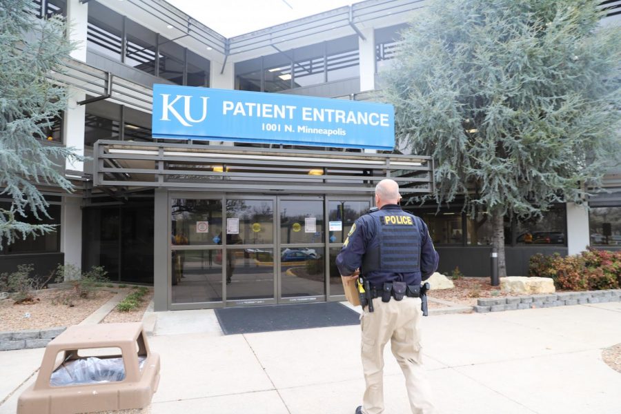 Wichita State Police Sergeant Christopher Tenet delivers a box of personal protective equipment to the University of Kansas Medical Center on March 27, 2020.