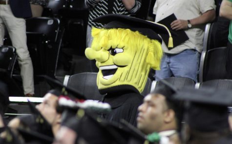 WuShock wears a cap and gown at last May’s LAS commencement ceremony.