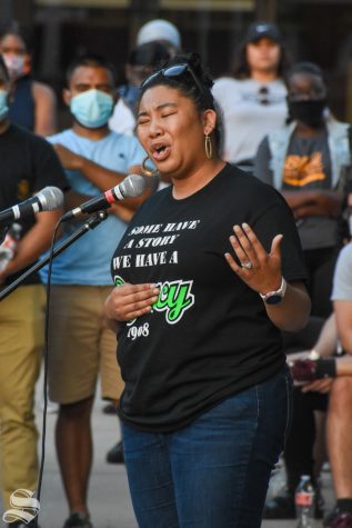 Danielle Johnson, assistant director of the Office of Diversity and Inclusion, speaks Friday night at a candlelight vigil on campus. “I want you, my WSU community, to not just talk about it, but be about it,” said Danielle Johnson, assistant director of the Office of Diversity and Inclusion.