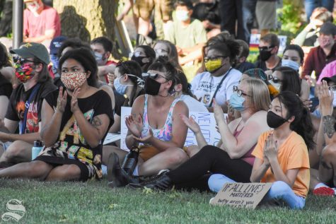 A few hundred people gathered outside of the east entrance of the Rhatigan Student Center on Friday evening for a Black Lives Matter rally. Attendees heard from five speakers, all student women of color who helped organize the event.