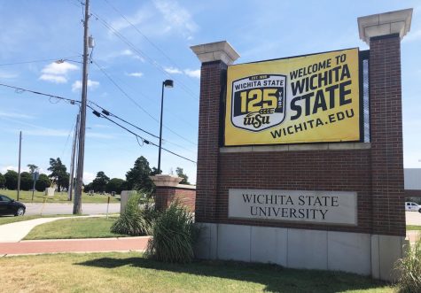A banner celebrating Wichita State University's 125th anniversary hangs on a university sign at 21st and Hillside. WSU is planning a number of events to mark the anniversary.