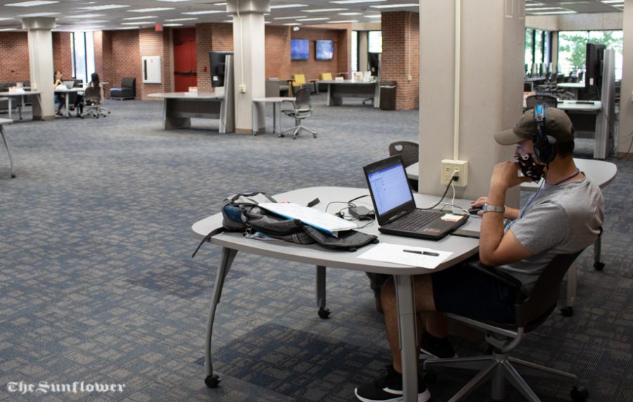 Sophomore Pedro Cupertino studies in the Ablah Library. While masks and social distancing are required at the library, staff are working to provide students with the resources they need.