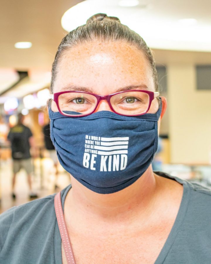 Junior Andrea Baker smiles for a photo with her mask on Monday, August 17 inside the RSC.