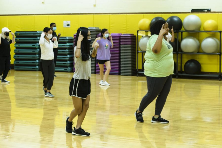 KVersity dance members practicing their latest dance at the Heskett center, Room 141, on Saturday.