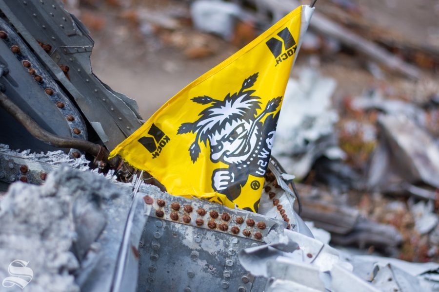 A Wichita State flag sits atop a pile of twisted metal remains from the 1970 WSU plane crash near Silver Plume, Colorado.