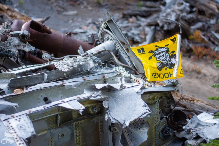 A Wichita State flag sits atop a pile of twisted metal remains from the 1970 WSU plane crash near Silver Plume, Colorado.