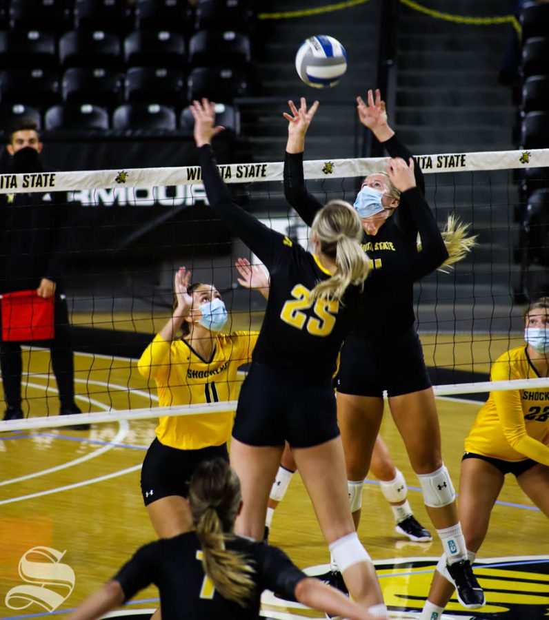 Wichita State senior McKayla Wuensch sets the ball to her teammate during a scrimmage on Sept. 12 inside Charles Koch Arena.