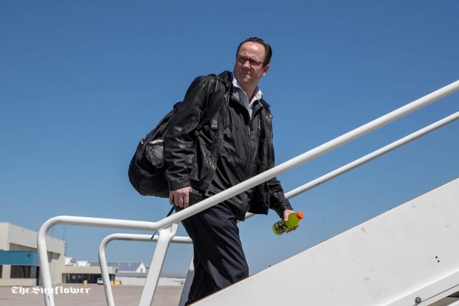 Gregg Marshall loads the plane in Wichita on March 31, 2019 on their way to New York for the NIT.