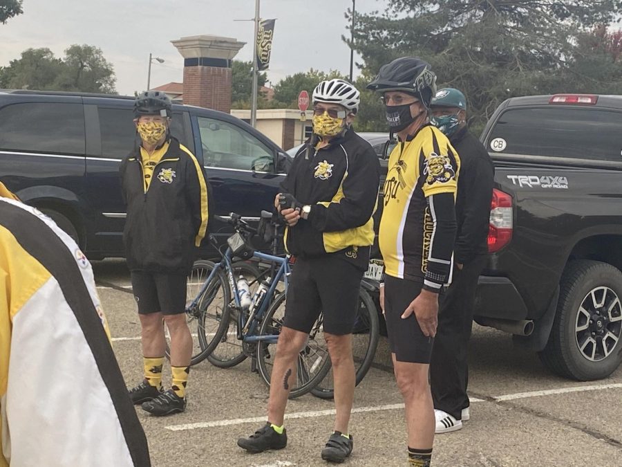 Paul Harrison, Kelly Harrison and Rick Stephens address the crowd at the 1970 plane crash memorial on campus before leaving on their eight-day bike ride to the plane crash site near Silver Plume, Colorado.