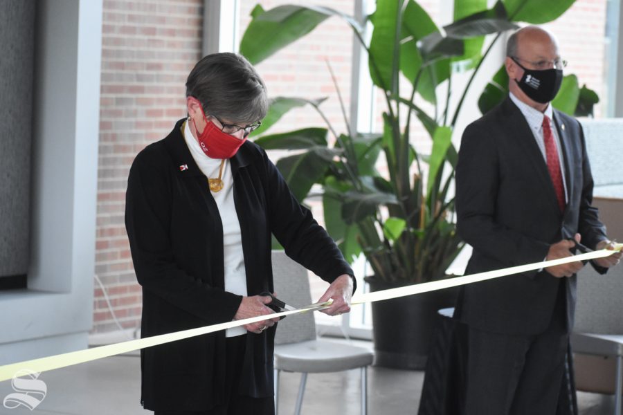 Governor of Kansas Laura Kelly cuts the ribbon to open the new Molecular Diagnostics Lab on Monday, Oct. 19 inside the John Bardo Center.