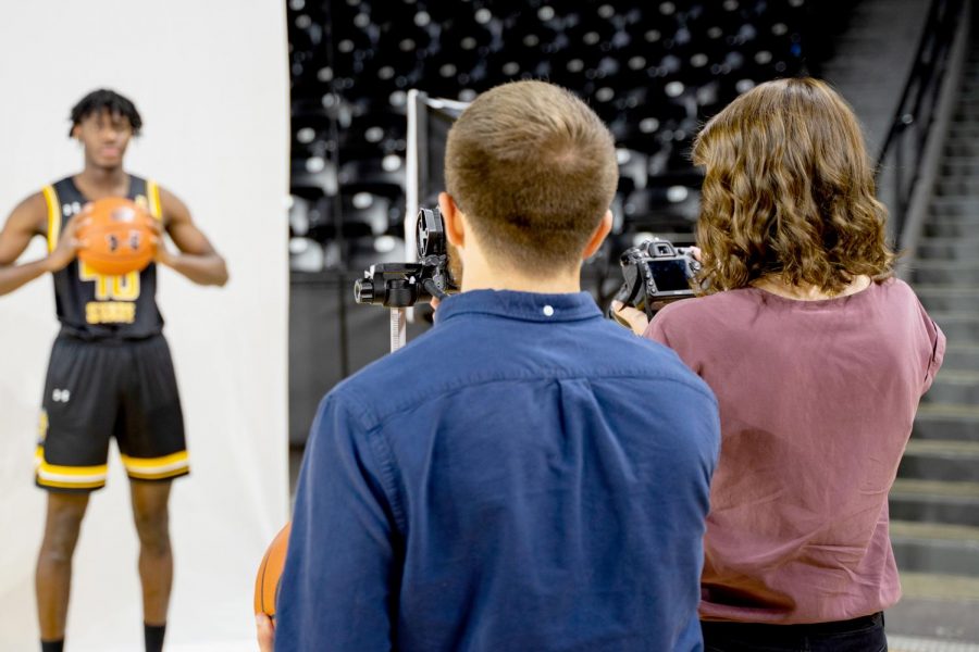 Sunflower photographers Easton Thompson and Morgan Anderson cover men's basketball media day on Oct. 15, 2019 inside Charles Koch Arena. 
