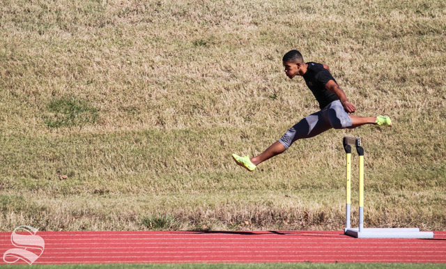 Wichita State junior Yuben Goncalves jumps over a hurdle during a scrimmage on Friday, Oct. 30 at Cessna Stadium. 