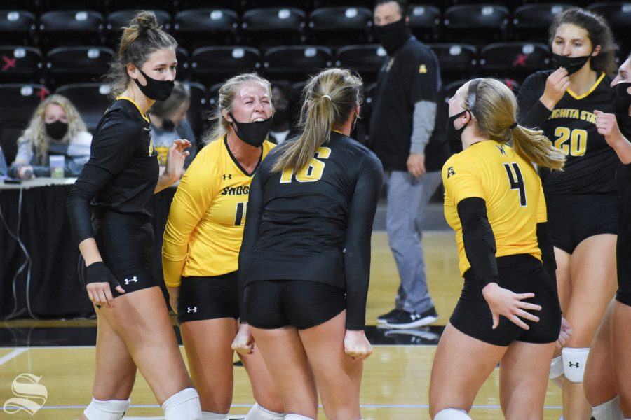 Wichita States McKayla Wuensch celebrates with her teammates after scoring against the yellow team during the Black and Yellow Scrimmage on Friday, Oct. 16. The black team won in five sets, 3-2.