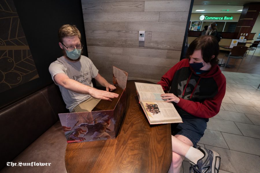 Eldon Taskinen (left) and Tyler Gardner (right) talk about the game. WSUs Dungeon and Dragon club was formed in the Spring of 2019.