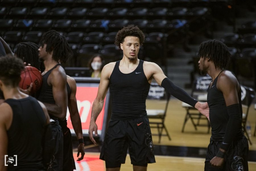 Oklahoma State freshman Cade Cunningham greets his teammates prior to the Cowboys game against the Shockers on Dec. 12 inside Charles Koch Arena.