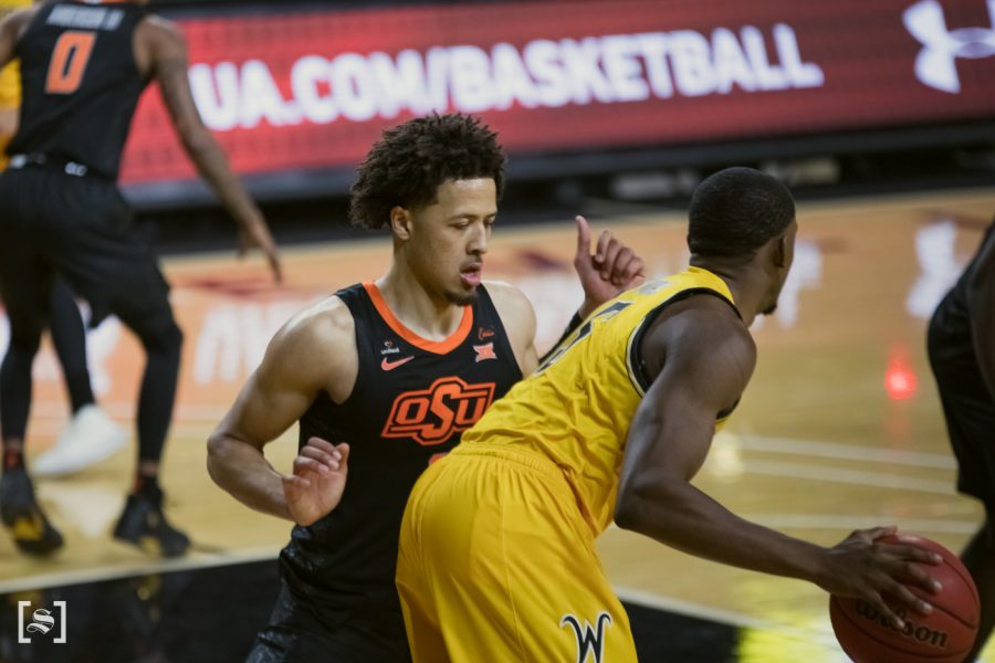 Oklahoma State freshman Cade Cunningham plays defense during the game against OSU at Charles Koch Arena on Dec.12.