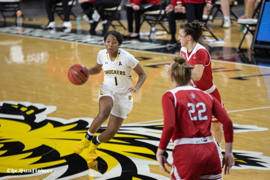 Wichita State sophomore DJ McCarty dribbles toward the basket during the game against the South Dakota Coyotes at Charles Koch Arena on Dec. 10.