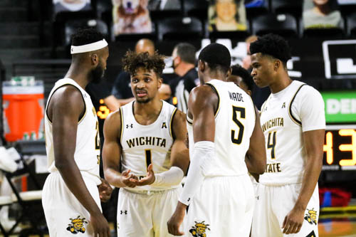 Wichita State sophomore, Tyson Etienne communicates the next play to his teammates during a game against Newman University on Dec. 30 at Charles Koch Arena.