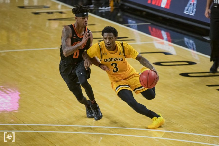 Redshirt senior Alterique Gilbert drives to the basket in WSUs game against Oklahoma State on Dec. 12 inside Charles Koch Arena.