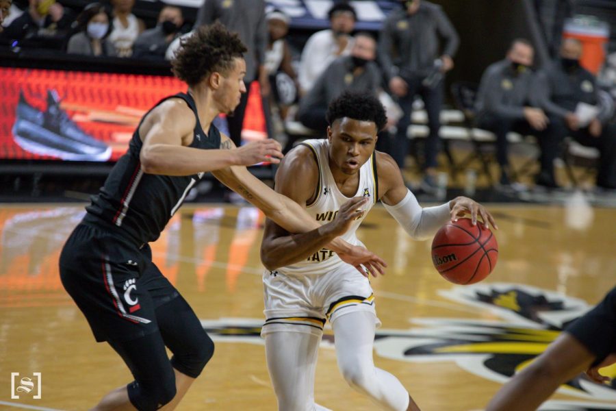 Wichita State freshman Ricky Council IV dribbles down the court during the game against the Cincinnati Bearcats at Charles Koch Arena on Jan. 10.