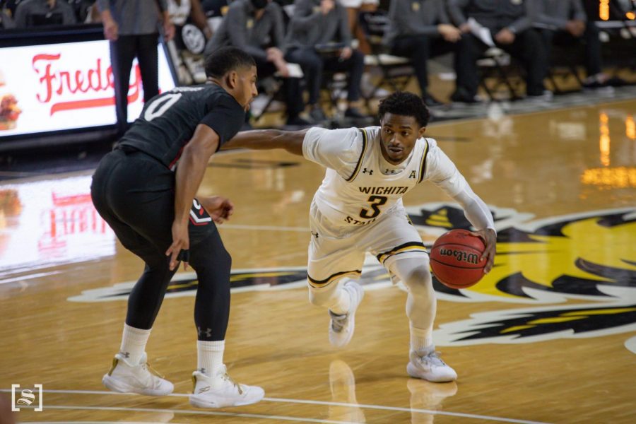 Wichita State redshirt senior Alterique Gilbert drives to the basket against Cincinnati on Jan. 10 inside Charles Koch Arena. 