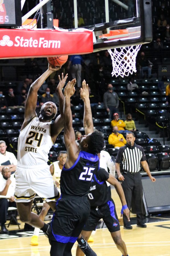 Wichita State junior, Morris Udeze tries to shoot a basket during a game against Tulsa at Charles Koch Arena on Jan. 13.