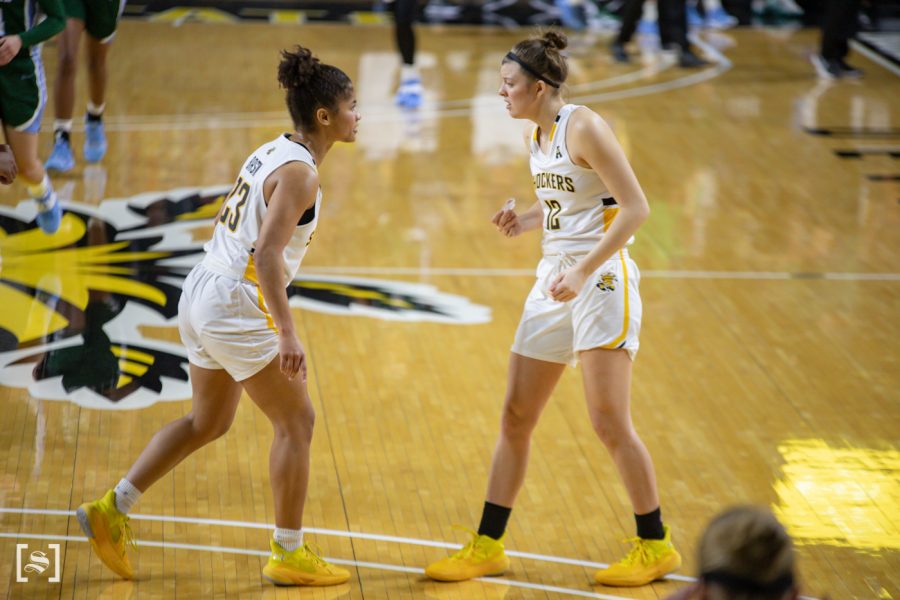 Wichita State Seraphine Bastin talks to Carla Bremaud before an inbound play. The game was held at Charles Koch Area on February 3, 2021.