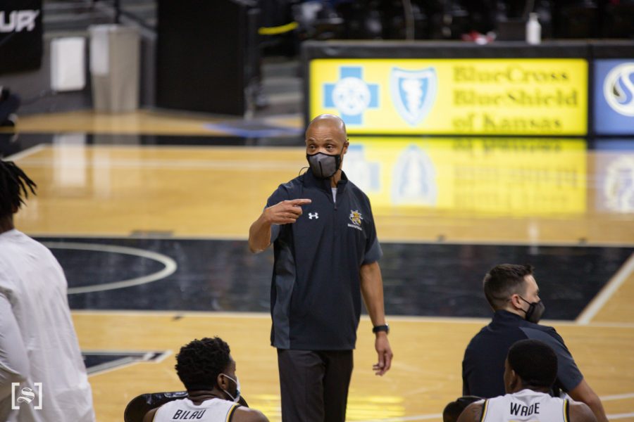 Wichita State Interim Head Coach Isaac Brown talks to a player during the game against Temple at Charles Koch Arena on Feb. 7.