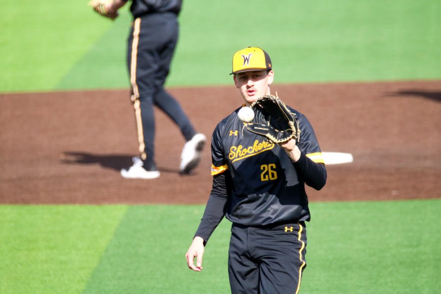 Wichita State junior, Liam Eddy catches the ball during a warmup before game at Eck stadium on Feb. 21