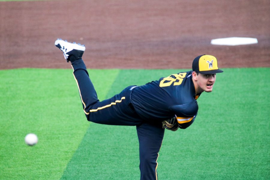 Wichita State junior, Liam Eddy throws the ball to his opponent during a game at Eck stadium on Feb. 21