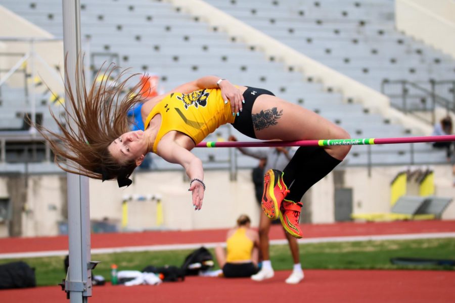 Wichita State graduate, Shania Vannoster leaps in high jump event during a track meet at Cessna Stadium on March 27.
