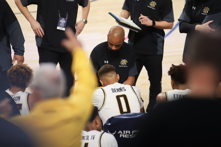 Head Coach Isaac Brown talks to the team during the game against USF at Dickies Arena on Mar. 12.