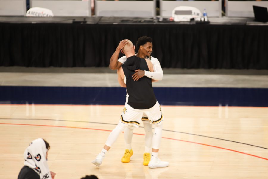 Wichita State redshirt senior Alterique Gilbert celebrates with Brycen Bush after their win against USF at Dickies Arena on Mar. 12.