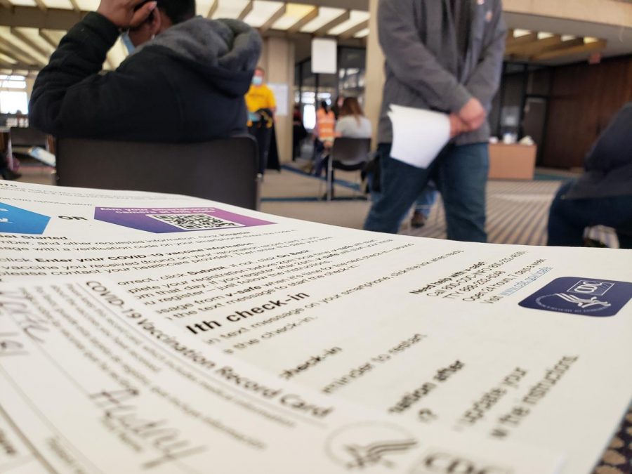 Check-in papers and a COVID-19 fact sheet greet Sedgwick County residents at the COVID vaccination site in downtown Wichita. 