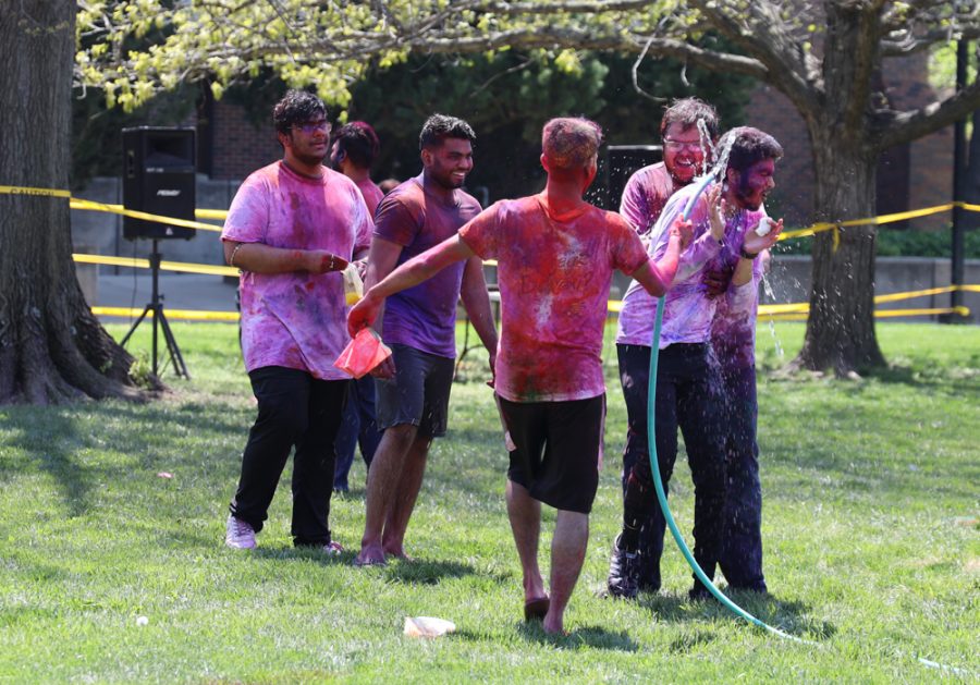 Studnts playing with water at Holli hosted by AHINSA at Hubbard Hall Lawn on April 24, 2021.
