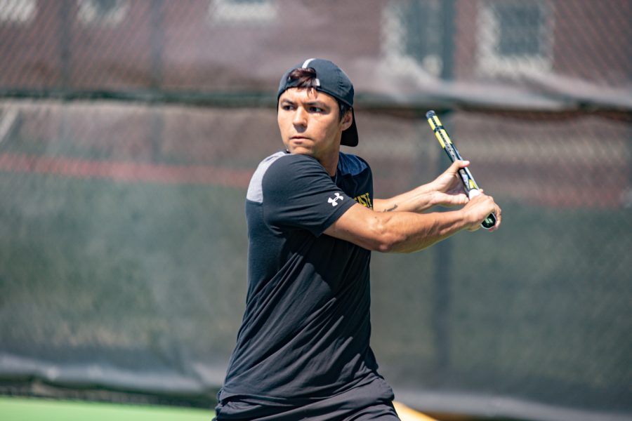 Wichita State Redshirt Sophomore Nicolas Acevedo returns the ball during the game against the SMU Mustangs at the Coleman Tennis Complex on April 2, 2021.