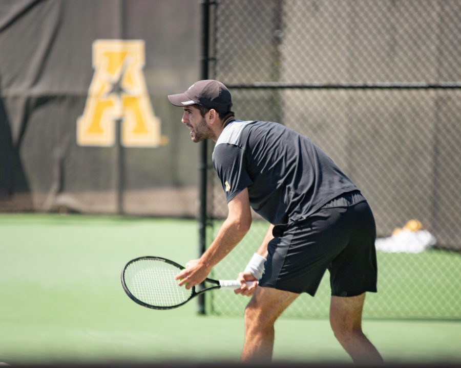 Wichita State Redshirt Sophomore Stefan Latinovic looks to serve during the game against the SMU Mustangs at the Coleman Tennis Complex on April 2, 2021.