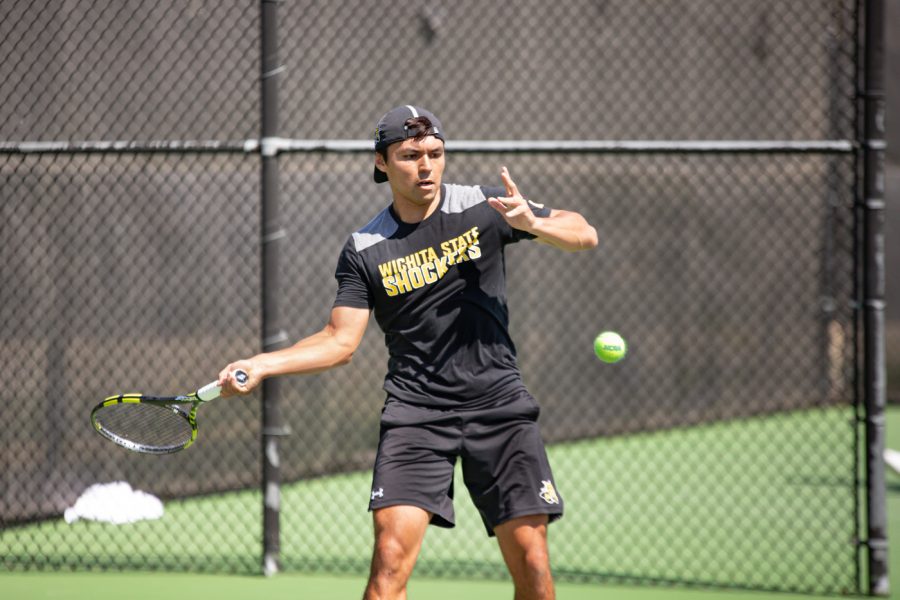 Wichita State Redshirt Sophomore Nicolas Acevedo returns the ball during the game against the SMU Mustangs at the Coleman Tennis Complex on April 2, 2021.