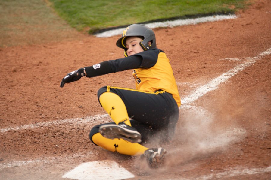 Wichita State junior Bailee Nickerson slides onto homebase during the game against Houston at Wilkins Stadium on April 9, 2021.