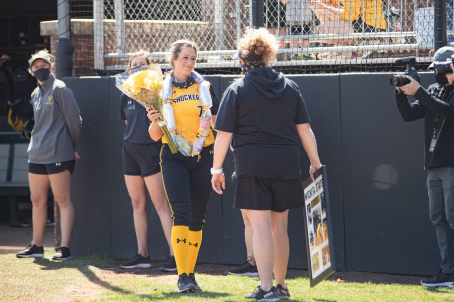 Wichita State redshirt senior Kaylee Huecker smiles during the seniors ceremony prior to the game against South Florida at Wilkins Stadium on April 25.