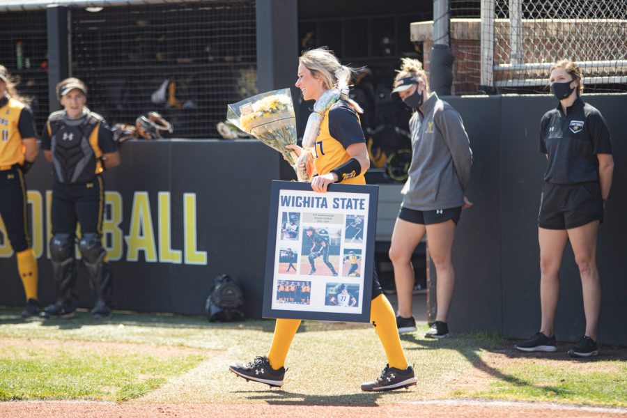 Wichita State redshirt senior Kaylee Huecker smiles during the seniors ceremony prior to the game against South Florida at Wilkins Stadium on April 25.