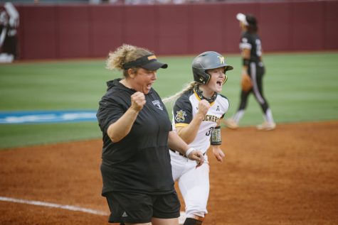 Wichita State freshman Addison Barnard celebrates with head coach Bredbenner during the game against Texas A&M on May 21.